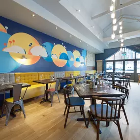 Stylish dining area at Zizzi Sevenoaks with modern decor and natural accents.