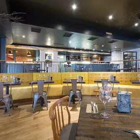 Stylish dining area at Zizzi Sevenoaks with modern decor and natural accents.