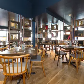 Stylish dining area at Zizzi Sevenoaks with modern decor and natural accents.