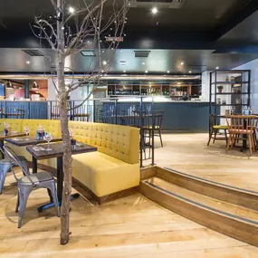 Stylish dining area at Zizzi Sevenoaks with modern decor and natural accents.