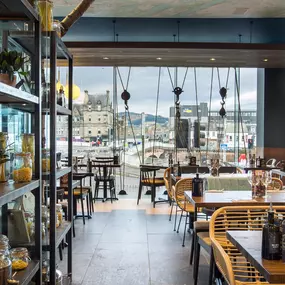 Zizzi Inverness, open-plan dining with full-height windows overlooking the River Ness.
