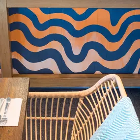 Zizzi Inverness, open kitchen with large mural by local artist.