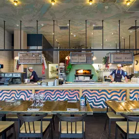 Zizzi Inverness, open kitchen with large mural by local artist.