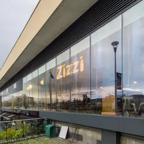 Zizzi Inverness, front-area glass wall offering street visibility and river outlook.