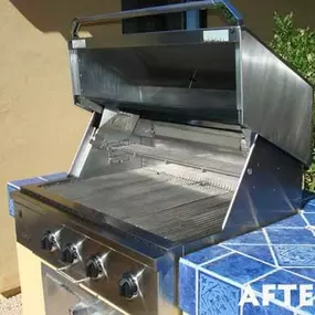 A built-in backyard grill sparkles after barbecue grill cleaning services in Phoenix.