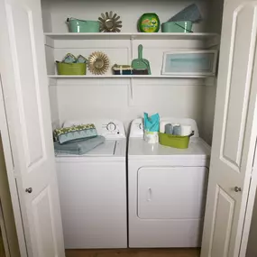 Model home laundry room and shelves