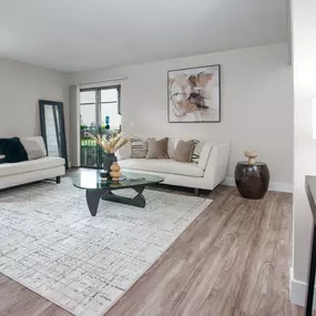 Model apartment living room with two couches and a coffee table