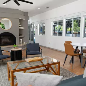 Leasing office seating area, fireplace, and windows