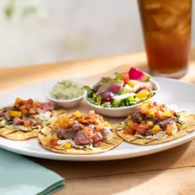 Wood-Grilled Steak Tacos—taco slaw, pico de gallo, cotija, avocado, lime