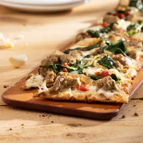 Sausage and Baby Kale Flatbread - housemade Italian sausage, cipollini onions, spicy pepper relish