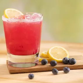 Blueberry Lemon Splash featuring Hendrick's Grand Cabaret, orange liqueur, lemon, house-made blueberry puree and peach.