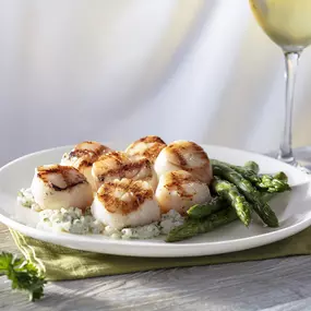 Caramelized Grilled Sea Scallops served with asparagus and mascarpone risotto.