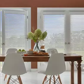 Our faux wood blinds can give you the natural look you want without the extra cost.