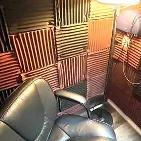 Interior photo of the sound testing booth for the AudioNova hearing clinic in Leesburg, FL on Highway 27