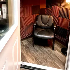 Interior photo of the sound testing booth for the AudioNova hearing clinic in Leesburg, FL on Highway 27