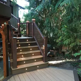 Composite Deck Stairs with railings and deck lighting built by Heilman Deck & Fence