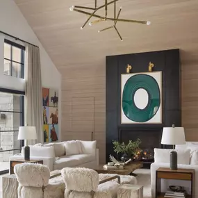 Outfit your modern living space with custom window treatments from GrandView Blinds & Designs. This image highlights tall drapery panels providing elegance and light management, perfectly suited for rooms with high ceilings and contemporary decor.