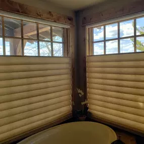 Maximize natural light and privacy in your bathroom with top-down bottom-up cellular shades from GrandView Blinds & Designs. Ideal for spaces like bathtub areas, these shades allow light in from the top while maintaining privacy below.