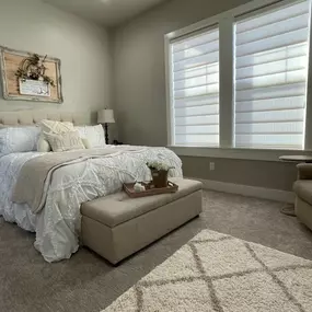 Create a serene bedroom atmosphere with custom sheer shadings from GrandView Blinds & Designs. These elegant window treatments softly diffuse incoming light, providing privacy and UV protection while maintaining a bright, airy feel.