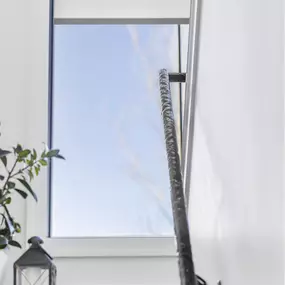 Enhance your home with stylish and functional roller shades from GrandView Blinds & Design. Perfect for windows on staircases, offering privacy and light control.