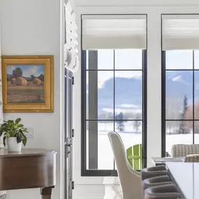 Elevate your space with elegant Roman shades from GrandView Blinds & Design. Perfect for large windows, providing a sophisticated look and adjustable light control with scenic views.