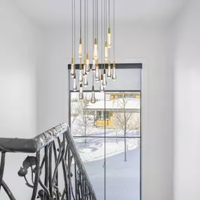 Enhance your staircase landing with quality window treatments from GrandView Blinds & Design. Offering light control and a finished look, our shades complement various architectural styles.