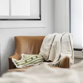 Achieve a clean and modern look with roller shades from GrandView Blinds & Design. These versatile window treatments offer excellent light control and privacy, perfect for living areas.