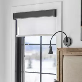 Enhance your bedroom's comfort and style with roller shades from GrandView Blinds & Design. These functional window treatments provide privacy and control natural light for a restful space.