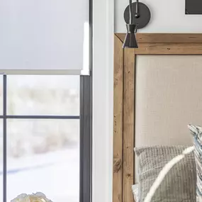 Achieve optimal light control and privacy in your bedroom with stylish roller shades from GrandView Blinds & Design. A clean and simple solution for a restful space.