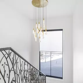 Elevate your staircase with functional and stylish roller shades from GrandView Blinds & Design. These window treatments provide light control and add a finished touch to landings and stairwells.