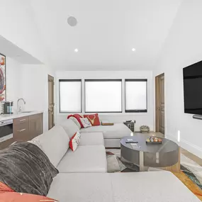 Enhance your living space with the clean lines and effective light control of roller shades from GrandView Blinds & Design. Perfect for modern interiors and multiple windows.