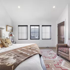 Enhance your bedroom with the clean design and light control of roller shades from GrandView Blinds & Design. These custom window treatments offer privacy and frame your view beautifully.