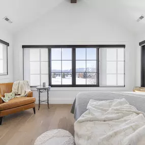 Enhance your bedroom with the clean design and light control of roller shades from GrandView Blinds & Design. These custom window treatments offer privacy and frame your view beautifully.