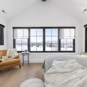 Enhance your bedroom's comfort and style with roller shades from GrandView Blinds & Design. These custom window treatments offer effective light control and privacy, beautifully framing your views.