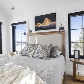 Enhance your bedroom's ambiance and privacy with stylish roller shades from GrandView Blinds & Design. These custom window treatments offer effective light control and a polished look.