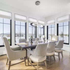 Enhance your dining space with elegant Roman shades from GrandView Blinds & Design. These custom window treatments offer sophisticated style and flexible light control for a beautiful ambiance.