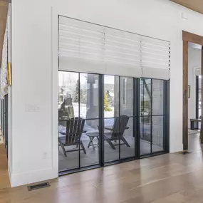 Dress your expansive glass doors or large windows with custom Roman shades from GrandView Blinds & Design. Offering elegant light control and privacy for impressive openings.