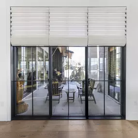 Enhance your indoor-outdoor living space with custom Roman shades from GrandView Blinds & Design. These elegant window treatments offer privacy and light control for large glass doors and windows.