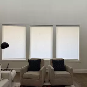 Enhance your living area's comfort and style with roller shades from GrandView Blinds & Design. These custom window treatments offer effective light control and privacy for a welcoming space.