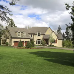 yellow house with newly installed roof
