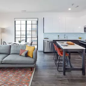 The Mason Apartments offer an open-concept living, dining, and kitchen area designed for modern living.