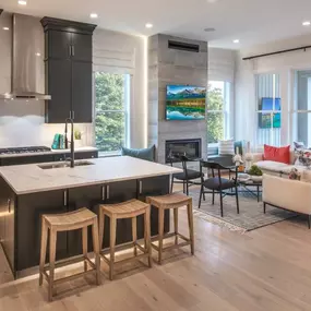 Kitchen overlooks great room and outdoor living