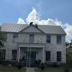 crew building standing seam metal roof