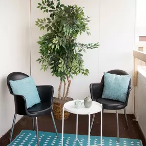 Balcony setup with table and chairs