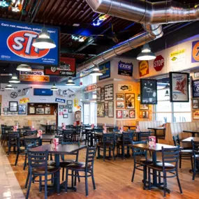 Portillo's Richmond interior tables with historic automobile themed memorabilia