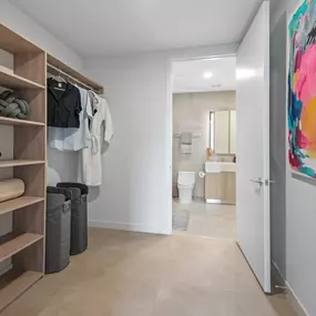 A well-organized walk-in closet with plenty of shelf space and hanging storage.