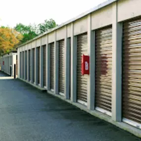 A side angle of the exterior Live Oak Storage brown storage units