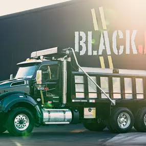 Sunset beaming down on a Blackjack Paving Work Truck