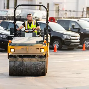 Blackjack Paving Contractor Driving a Compaction Roller