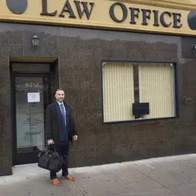 Nick Khalifeh, Esq. in front of our office